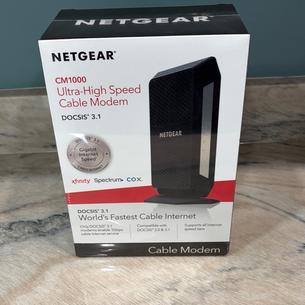 NETGEAR Black and White CM1000 Ultra-High Speed Cable Modem Box